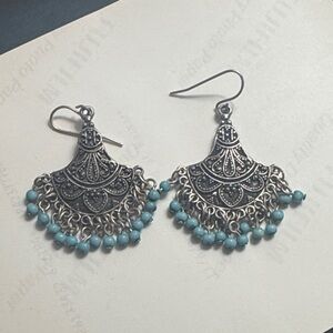 Oxidized silver-toned fan-shaped dangle earrings with blue beads.